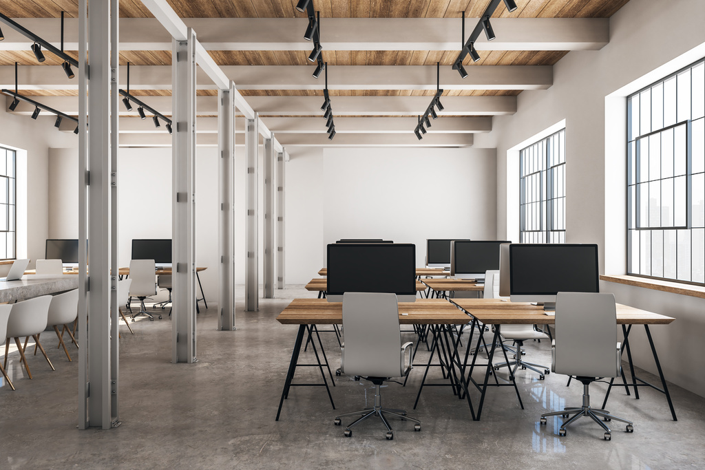 a room with computers and tables